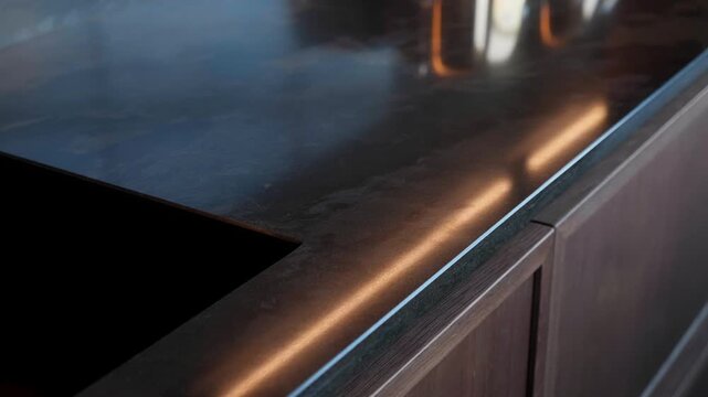 Trendy black quartz stone with luxury background texture. Kitchen countertops with modern interior design and counters. Nobody