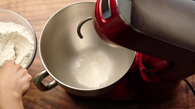 Add all-purpose flour by tablespoons to a stainless steel bowl, red stand mixer
