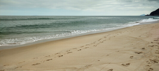 Sea river water beach cove ocean wave sand land stone rock mountain hill forest tree flowers bushes vegetation blue sky cloudy cloud horizon landscape island vacation surfing sport life nature