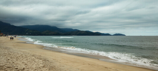 Sea river water beach cove ocean wave sand land stone rock mountain hill forest tree flowers bushes vegetation blue sky cloudy cloud horizon landscape island vacation surfing sport life nature