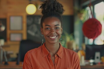 Fototapeta premium Happy young black female Handling shipping and logistics in startup company office