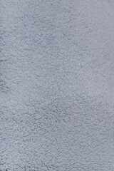 Soft and fluffy light blue fabric, ideal for cozy projects or home decor.