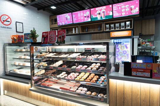 KUALA LUMPUR, MALAYSIA - NOVEMBER 21, 2023: Dunkin' Donuts cafe in KLIA, Terminal 1. Dunkin' Donuts is an American multinational coffee and doughnut company.