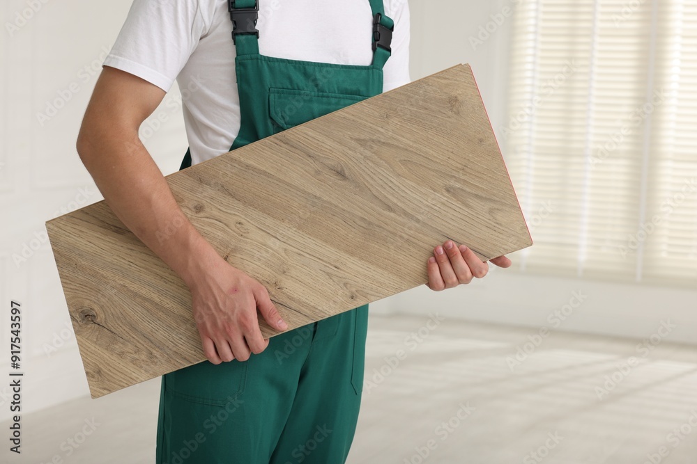 Canvas Prints Worker with sample of wooden flooring indoors, closeup