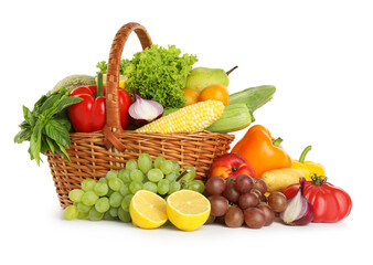 Different fresh fruits and vegetables in wicker basket isolated on white