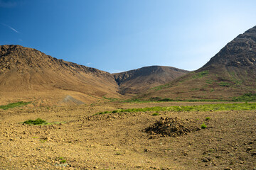A supercontinent called Pangea, the Tablelands are a unique ultramafic geological rock formation - peridotite in Newfoundland—a barren, orange landscape of the Earth's inner bare rock, the mantle. 