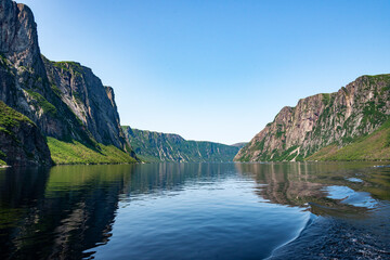 Western Brook Pond, a fjord located in Gros Morne National Park. The jagged mountains and rock wall...