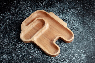 The sideboard is made of wood for serving snacks, fruits, nuts, cheeses, meats and original serving of main dishes. Luxury products from hard and exotic wood species. Accessories for a modern kitchen.