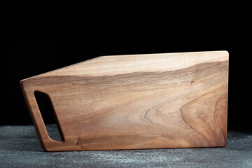 The sideboard is made of wood for serving snacks, fruits, nuts, cheeses, meats and original serving of main dishes. Luxury products from hard and exotic wood species. Accessories for a modern kitchen.