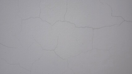 Obraz premium Small cracks on the white wall