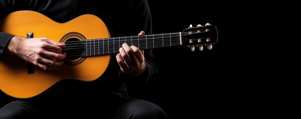 Obraz premium Closeup of a musician's hands playing an acoustic guitar.