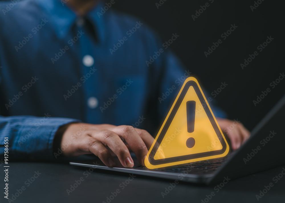 Aufkleber User or developer working on laptop computer with triangle caution warning sign for notification error and maintenance concept, computer virus detected, personal data protection, network security.
