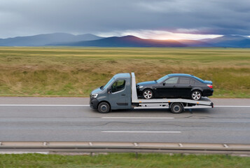 Flatbed Tow Truck Transporting Сar To Dealership