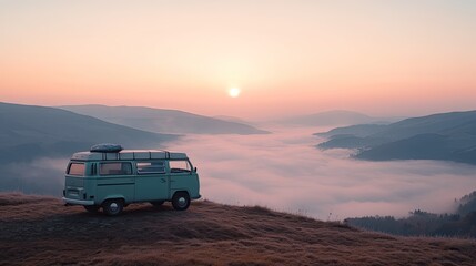 A classic van is parked on top of a mountain, with the sunrise and fog and mountains as a backdrop in the morning. Winter viewpoint, sea of fog. Leave space for text