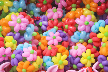Colorful many balloons twisted into flower shape patterns or bouquet background