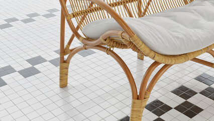 Close-up photo of a rattan chair with white cushions. On a white tile floor with a black and white...