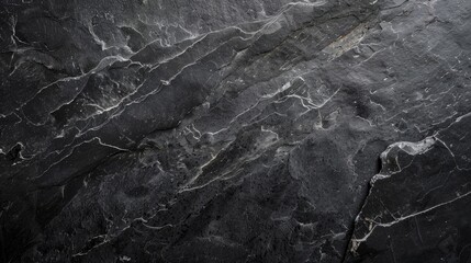 Obraz premium Pattern of black natural stone background with high resolution. Top view with space for copying.