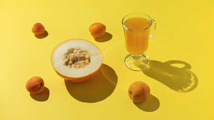 Fresh Melon and Apricot Juice on Vibrant Yellow Background