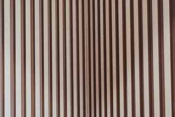 Stylish solid wooden battens wall. Vertical pattern design, backdrop interior design