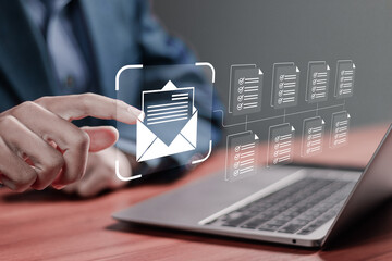 Email marketing or newsletter concept, diagram, Businessman use laptop to send bulk documents via email. Direct selling projects in business List of customers who want to send by email.