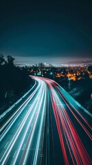 Vibrant city lights illuminating a winding highway at night