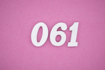  The numbers are made of white painted wood. Laying on the floor was pink paper.