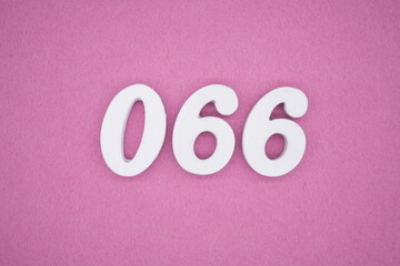  The numbers are made of white painted wood. Laying on the floor was pink paper.