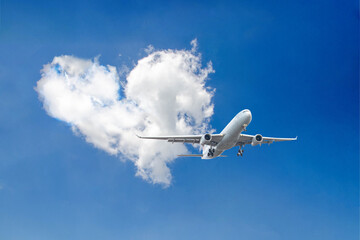 White passenger airplane flying in the sky amazing clouds in the background