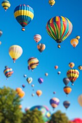 Obraz premium A colorful hot air balloon festival with miniature balloons floating in the sky, enhanced by the tilt-shift effect. 
