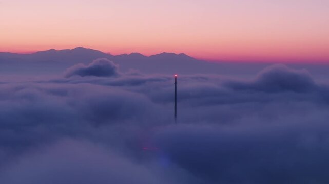 The Downtown Los Angeles, California looks enchanting as the sun rises, captured beautifully in 4K. The cityscape with faraway mountains creates a serene and breathtaking atmosphere