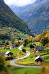 Obraz premium A scenic mountain village with tiny houses and winding roads, enhanced by the tilt-shift effect. 