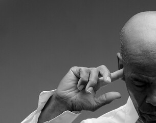 deaf man suffering from deafness and hearing loss on grey background with people stock image stock...