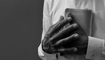 praying to god with hands together on black background with people stock image stock photo	