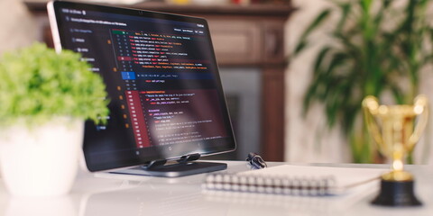 Programmer's program code on a computer screen. Web development and coding concept.
