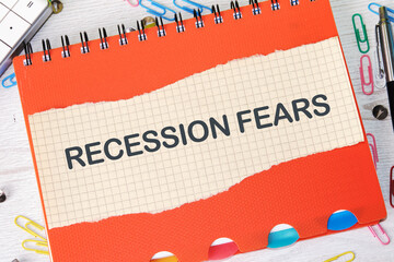 Business and recession fears concept. Copy space. Recession fears symbol. Concept words Recession on a piece of paper on a notebook