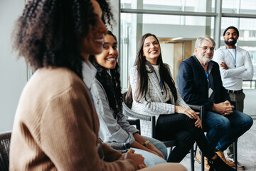 Multiethnic colleagues networking and laughing during a business meeting