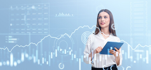 Businesswoman using tablet, forex diagrams with lines and candlesticks
