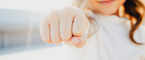 Naklejka premium Close Up of a Girl's Fist