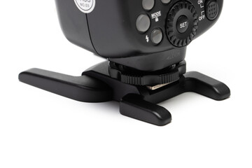 rear view of speedlight or flash stand. attached to a speedlight. Isolated in white background.