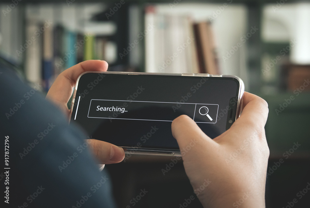 Wall mural businessman hand typing on smartphone with bar tool to search for information using for your website