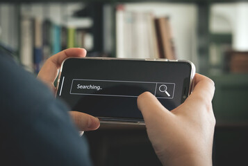 Businessman hand typing on smartphone with bar tool to search for information Using for your website, the discovery of information, search engine optimization