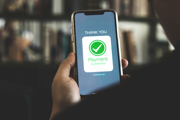 Online financial transactions and payment successful. Close-up of hand using smartphone for payment of shopping transaction By credit card online banking