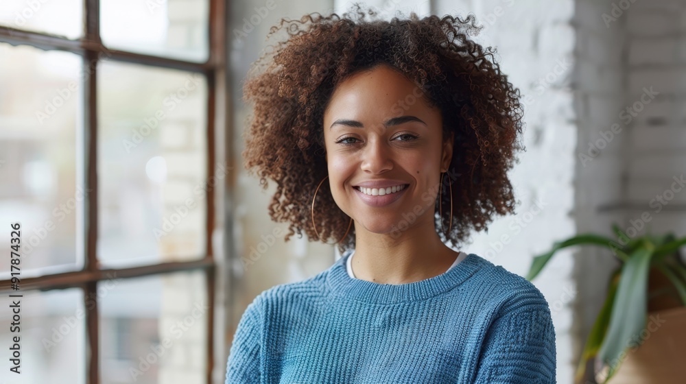 Wall mural The smiling curly-haired woman