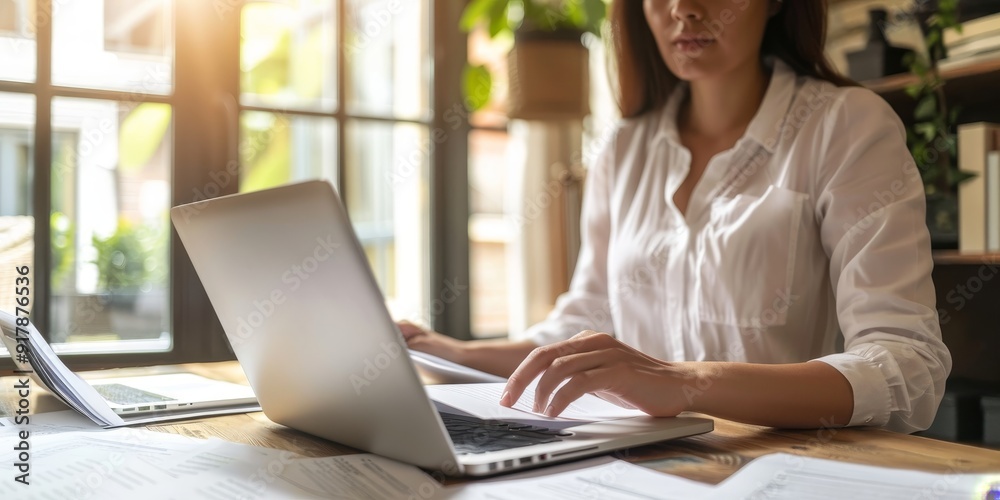 Aufkleber a businessperson with a policy document and a laptop, working intently at their desk, showcasing the
