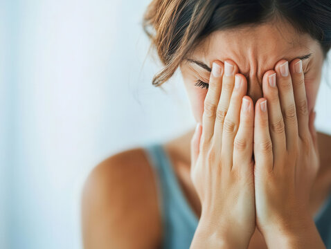 Closeup of a person covering their face, Shame and Depression, emphasizing the feelings of guilt that can accompany depressive symptoms