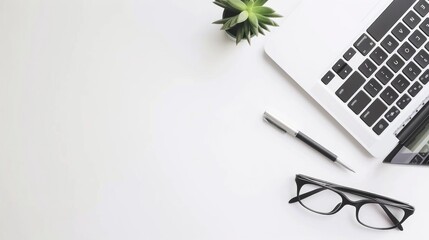 Minimalist Workspace with Laptop, Glasses, and Succulent