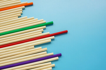 Fototapeta premium Path to success. Abstract wooden sticks highlighting unique colors of achievement.