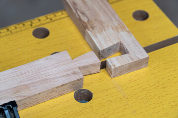 Senior man Cutting Dovetails With Woodworking Hand Tool for Hobby After retirement.