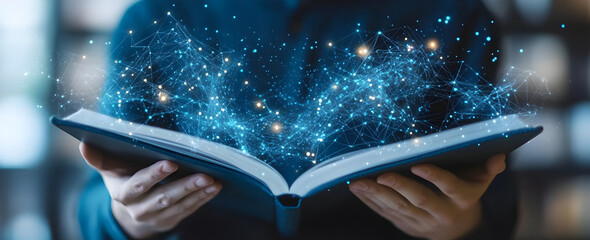 A person holds an open book radiating magical sparks and cosmic energies, symbolizing imagination and knowledge.