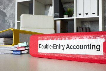 Double-entry accounting folder on an office desk. Accurate financial record-keeping and bookkeeping practices.
